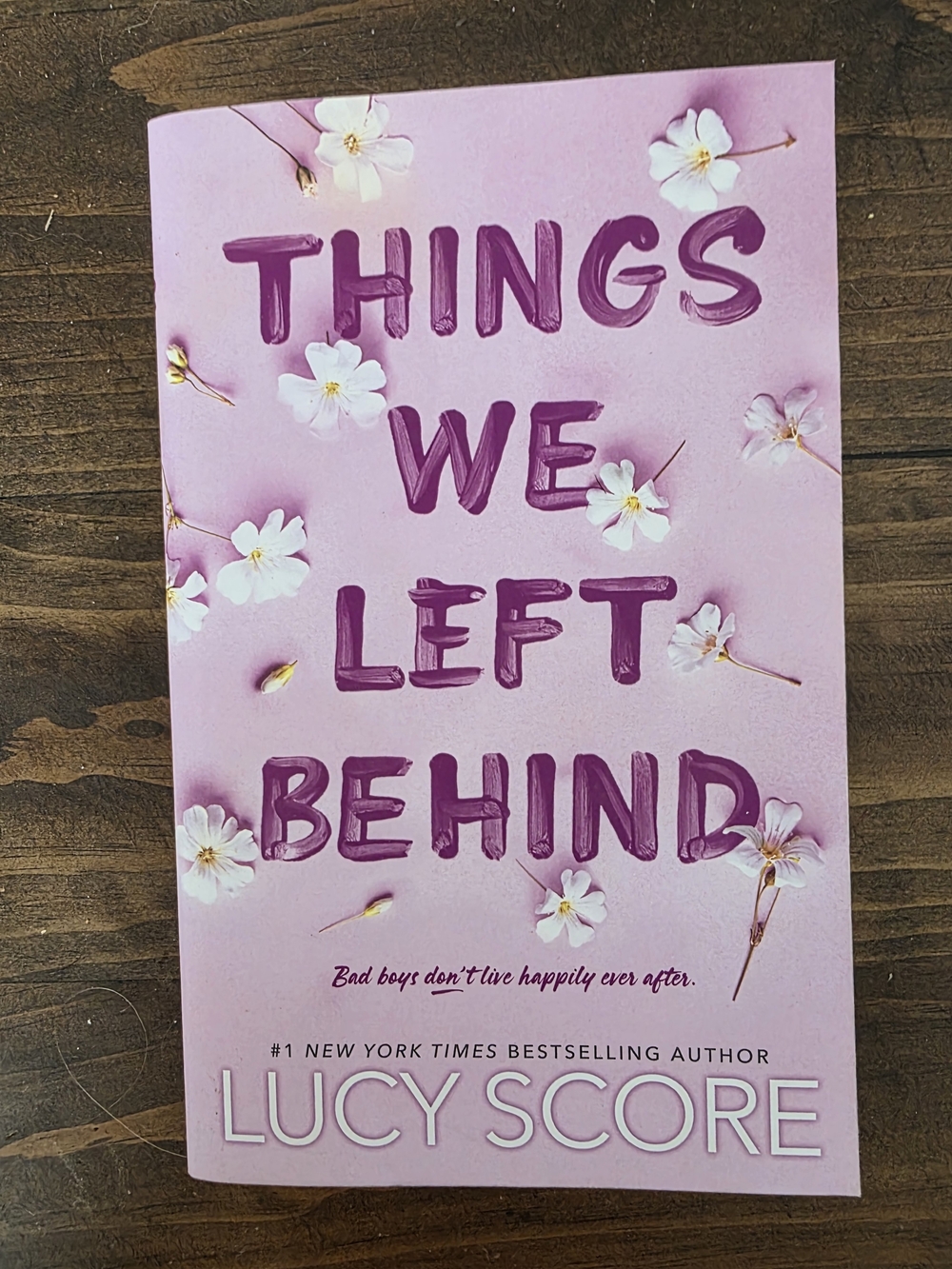Things We Left Behind by Lucy Score - Pink Floral Paperback
